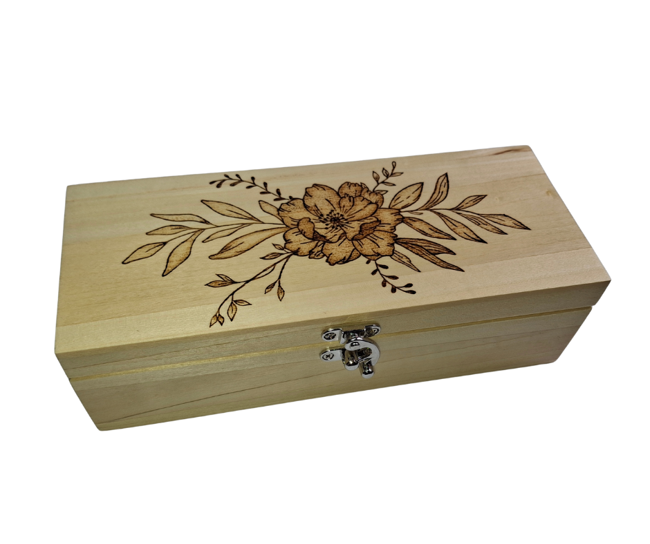 Light wood rectangular box featuring intricate pyrography floral patterns on its surface