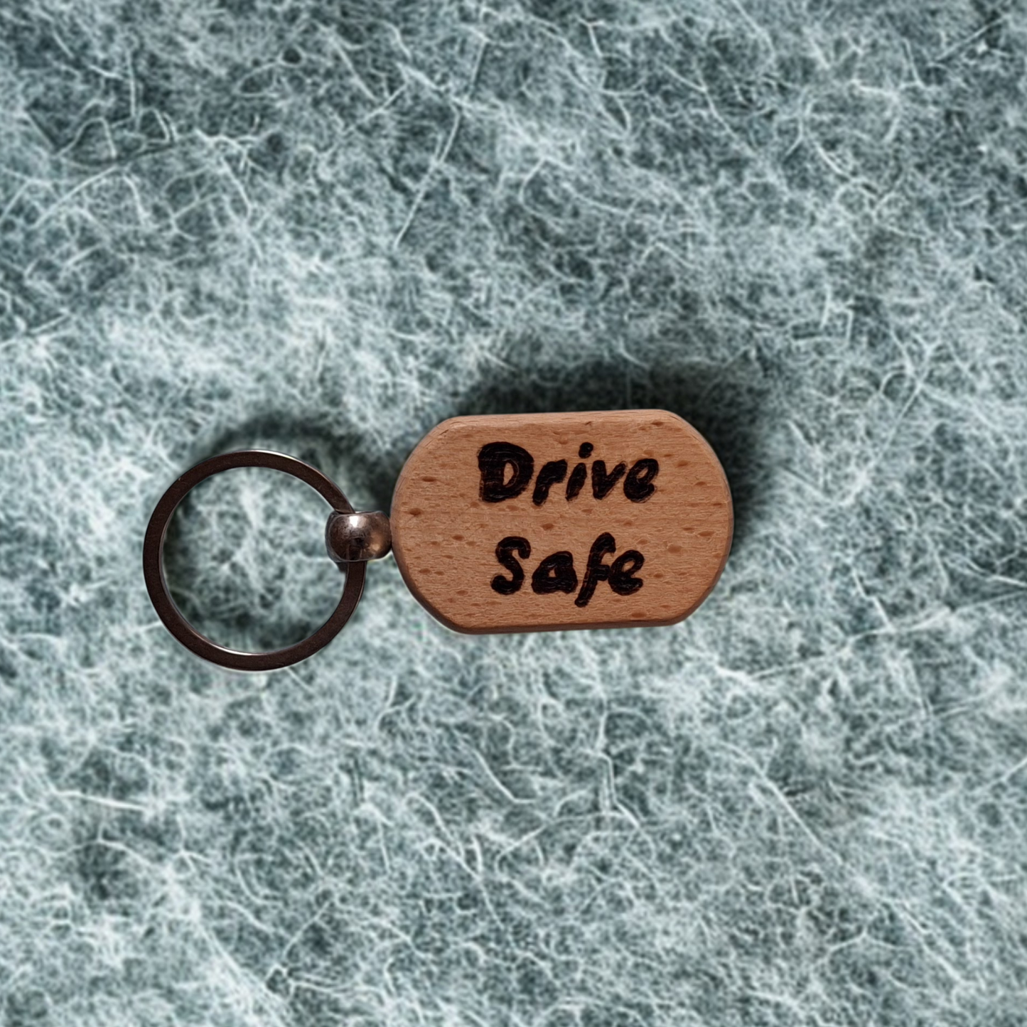 Oval beechwood keyring with 'Drive Safe' pyrography text and chrome split ring