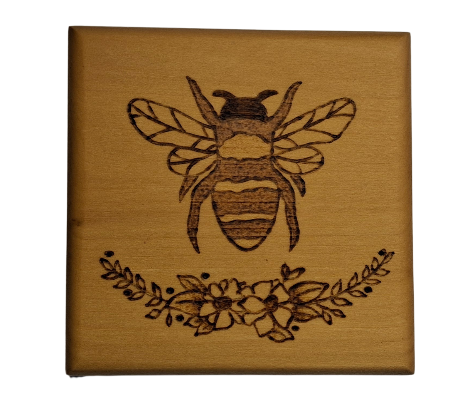 Tulipwood coaster with a picture of a bee on top of a half flower wreath