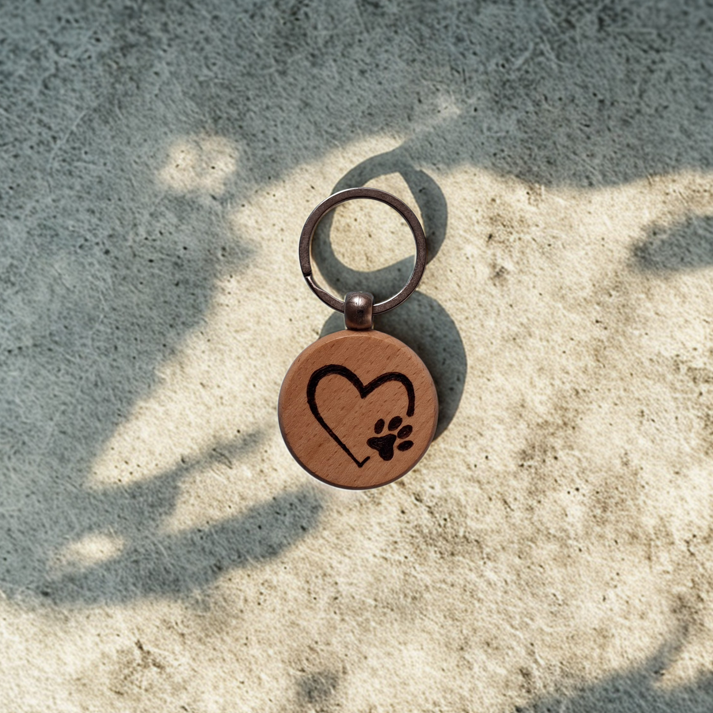 Round beechwood keyring with heart and paw print pyrography design and chrome split ring