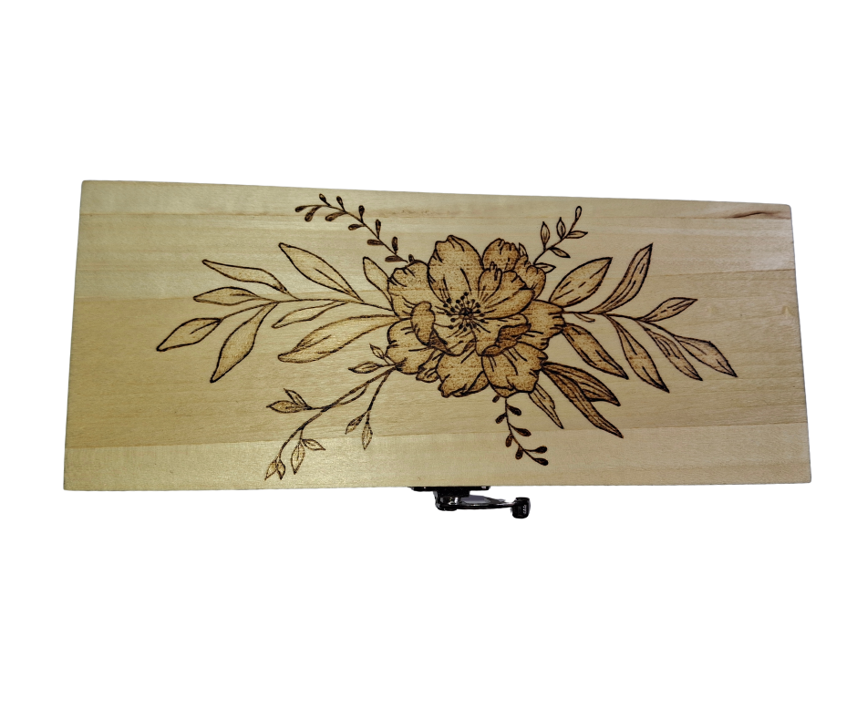 Light wood rectangular box featuring intricate pyrography floral patterns on its surface