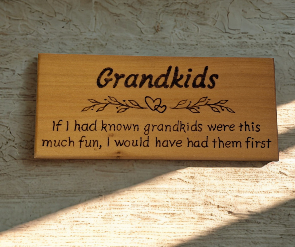 Hand-burnt wooden sign featuring "Grandkids" title, a decorative heart and leaf border, and the amusing "If I had known grandkids were this much fun..." quote.