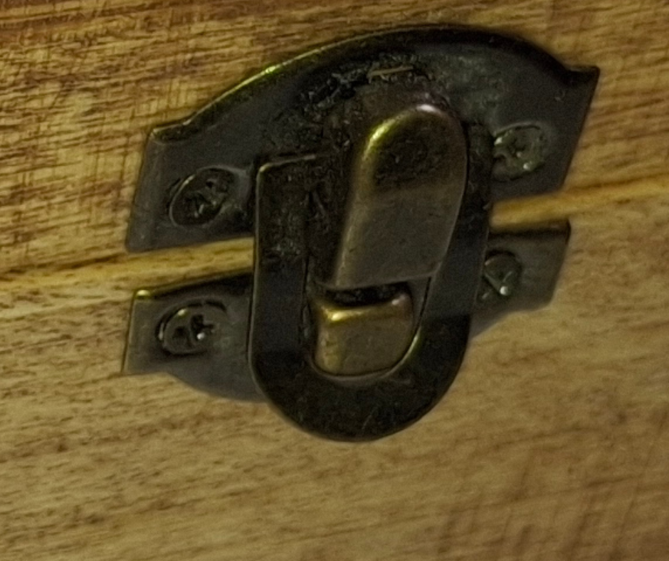 Decorative single brass clasp centered on the box's front panel