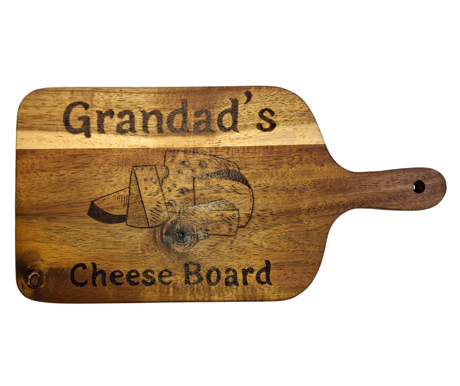 A multicolored, hand-decorated pyrography chopping board with the words "Grandad's Cheese Board" and illustrations of cheese chunks.