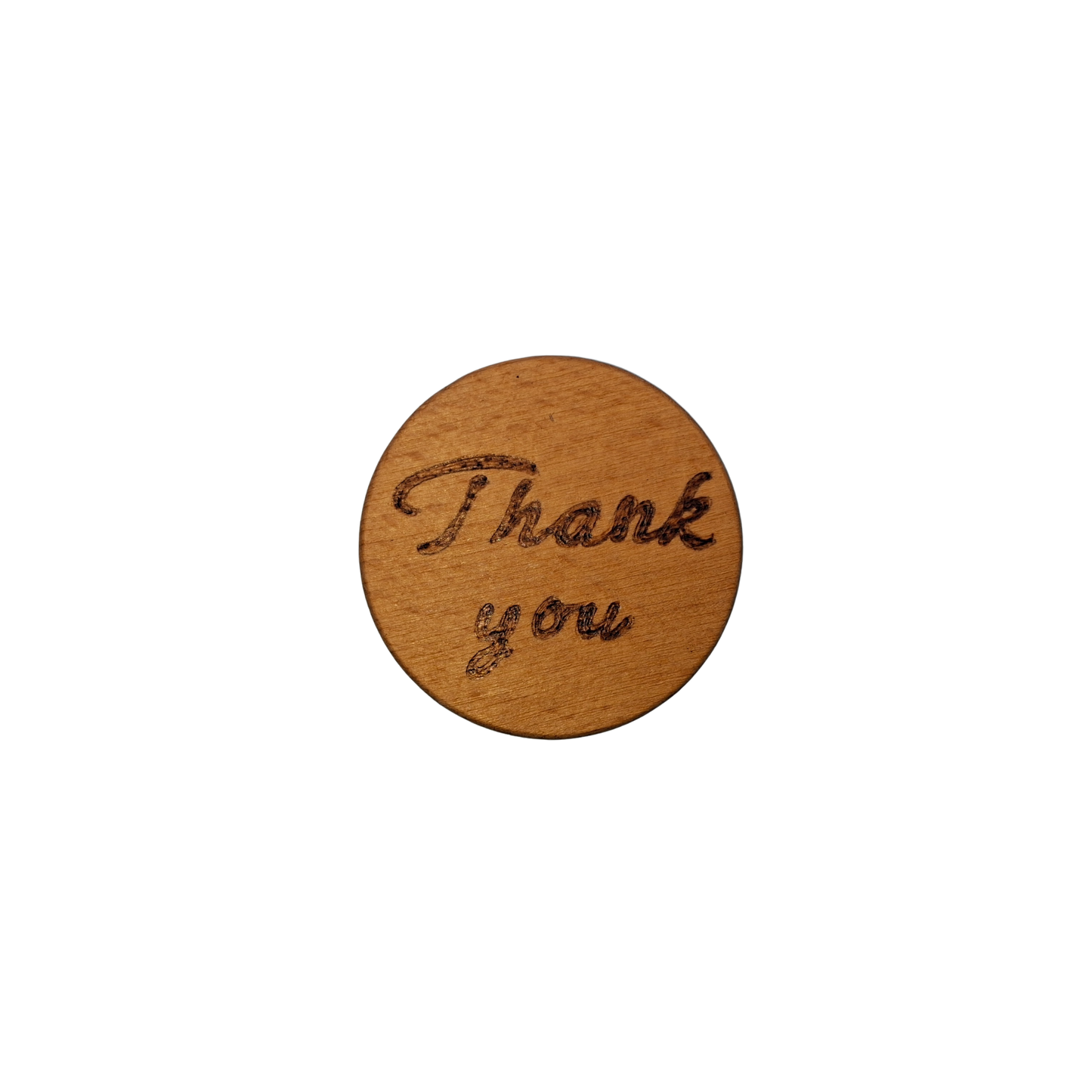 Close-up of a light-colored beechwood circle, 5cm in diameter and 0.4cm thick, featuring the words "Thank You" hand-burned into its surface using pyrography. The wood has a smooth, waxed finish and the text is clearly legible.