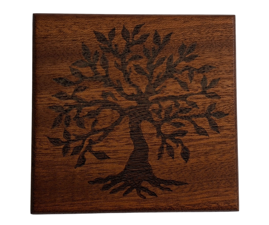 Sapele coaster with chamfered edges with a tree showing its roots burnt in