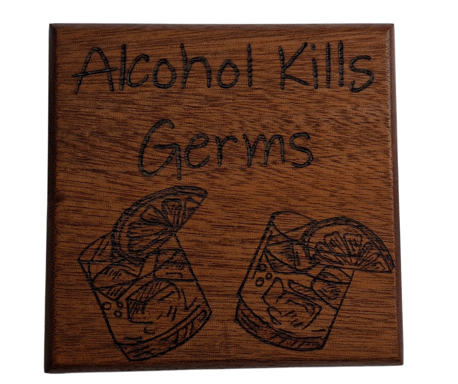 Sapele coaster with chamfered edges inscription "Alcohol Kills Germs" and a picture of 2 small glasses with lemon slices burnt in