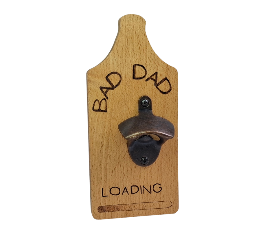 Decorative wall-mounted Beechwood bottle opener with a rustic metal opener, intricately hand-decorated with "Bad Dad... Loading" text