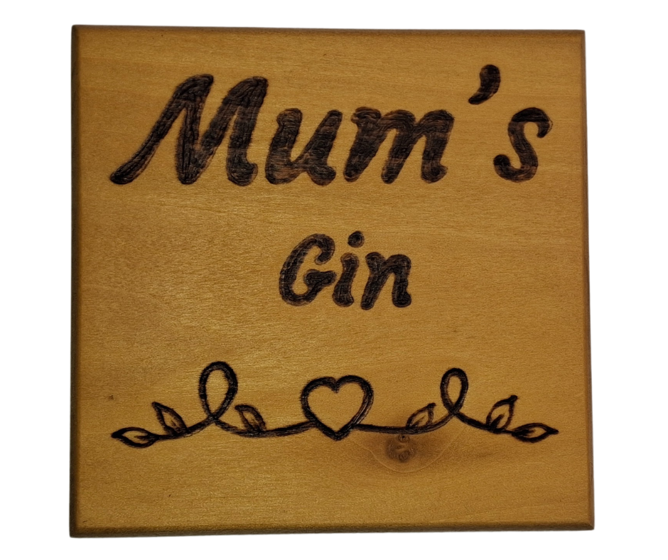Tulipwood coaster with chamfered edges inscription "Mum's Gin" with a decorative heart pattern burnt onto the wood