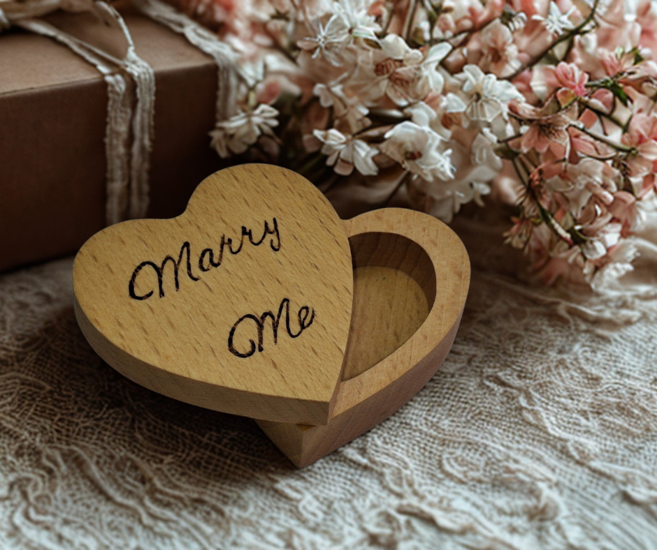 Hand-burnt heart-shaped ring box featuring "Marry Me" on its swivel lid, perfect for proposals