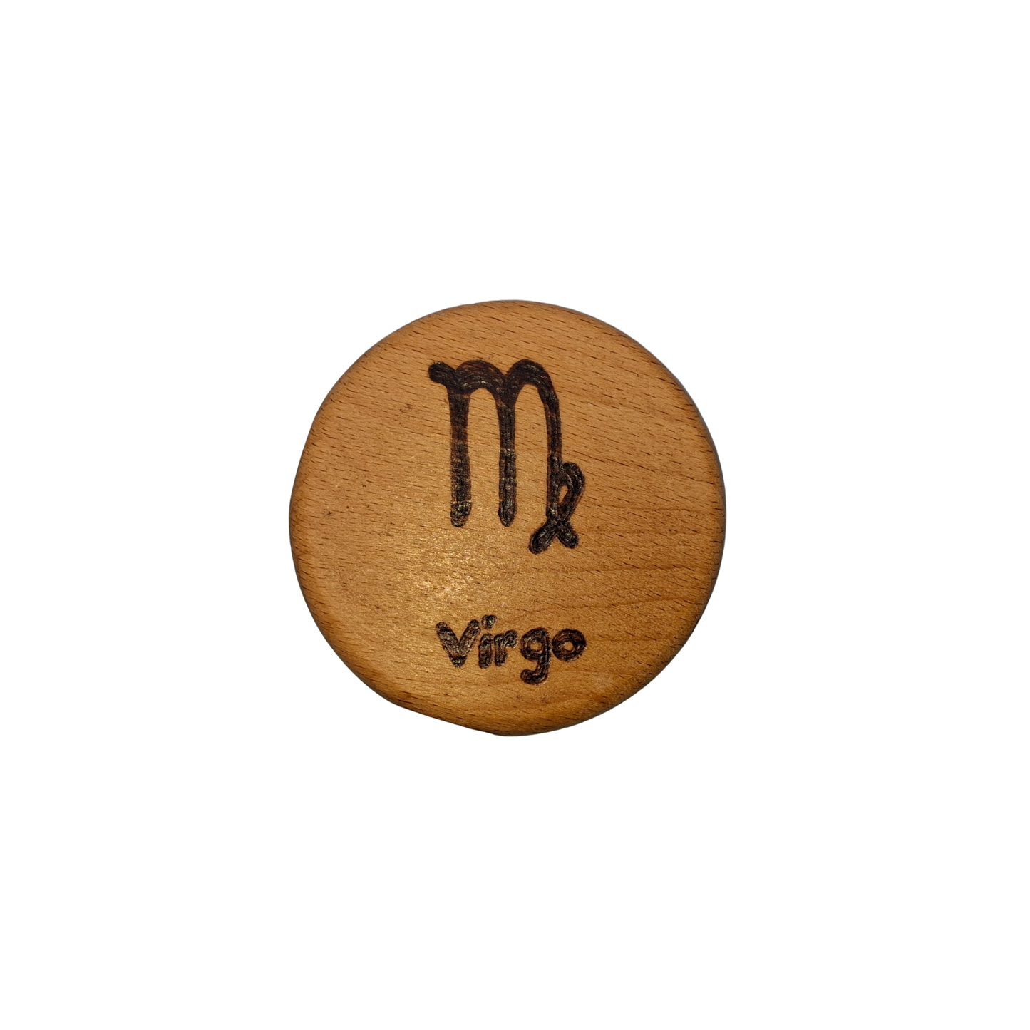 Close-up of a light-colored beechwood circle, 5cm in diameter and 0.4cm thick, featuring the words "Virgo" and an illustration of the star sign symbol, hand-burned into its surface using pyrography. The wood has a smooth, waxed finish and the text is clearly legible.