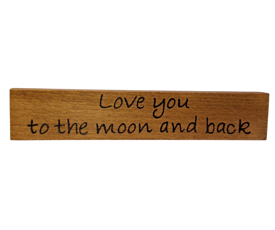 Decorative wooden desktop plaque, intricately hand-decorated with the romantic "Love You to the Moon and Back" lettering.