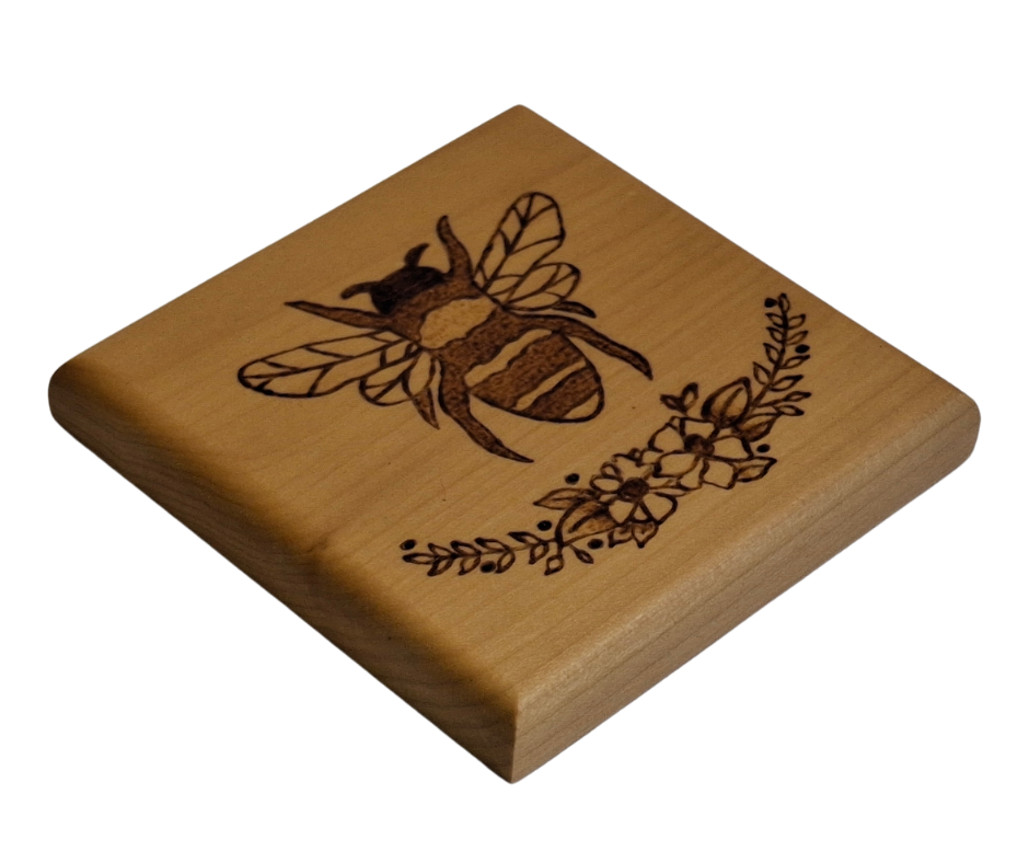 Tulipwood coaster with a picture of a bee on top of a half flower wreath
