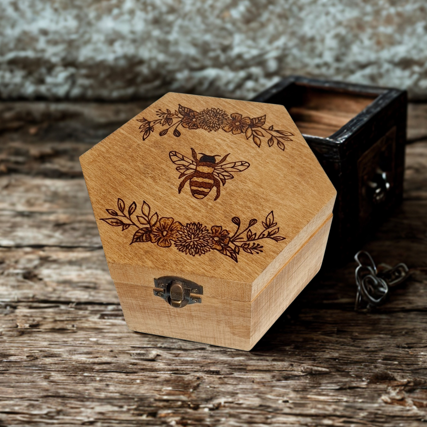 Hexagonal wooden jewelry box with a 'hand burnt' bee and floral design, featuring a brass clasp closure