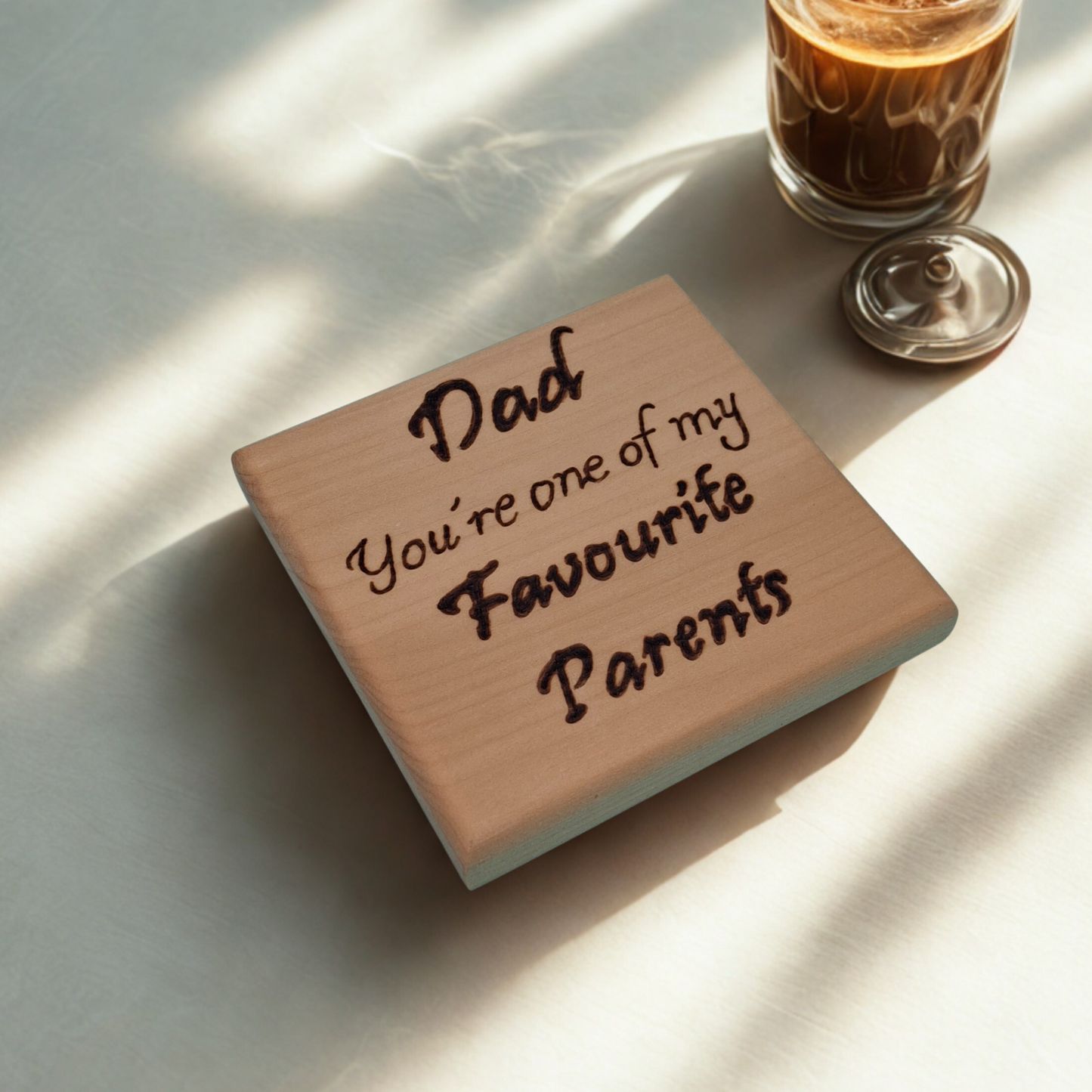 Light wooden coaster with pyrography text reading 'Dad You're one of my Favourite Parents'