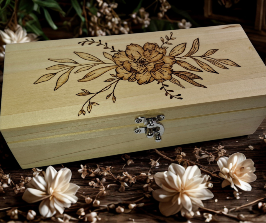 Light wood rectangular box featuring intricate pyrography floral patterns on its surface
