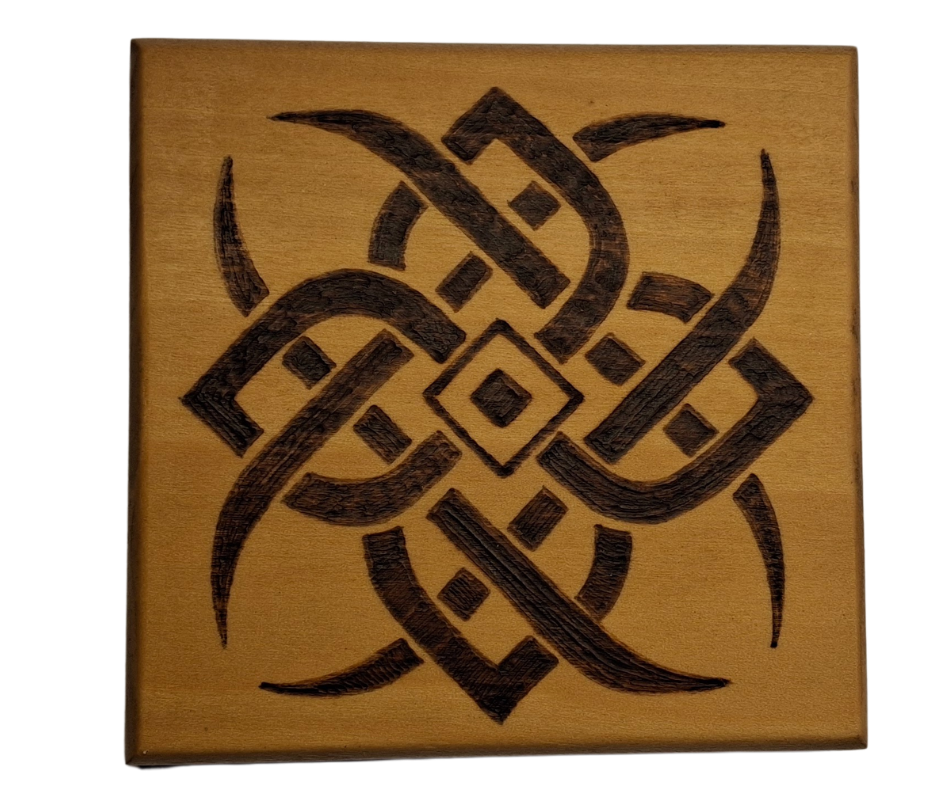 Tulipwood coaster with chamfered edges with a 4 point celtic star design burnt in