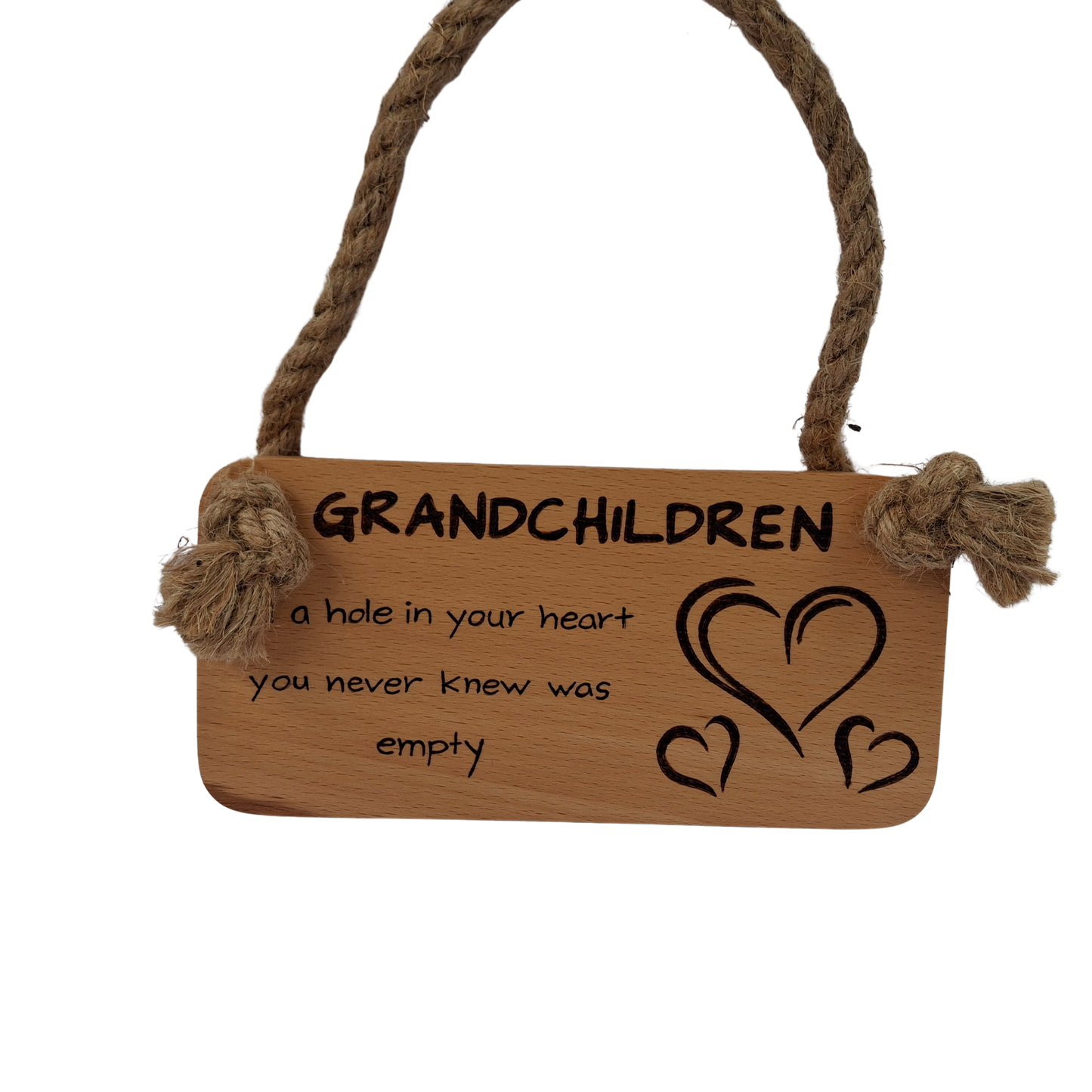 Wooden sign with "Grandchildren, fill a hole in you heart you never knew was empty" hand burnt and hearts hanging on a textured surface