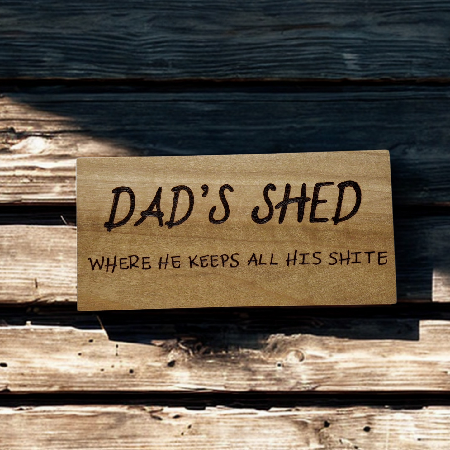 Hand decorated plaque wording Dad’s shed where he keeps all his shite