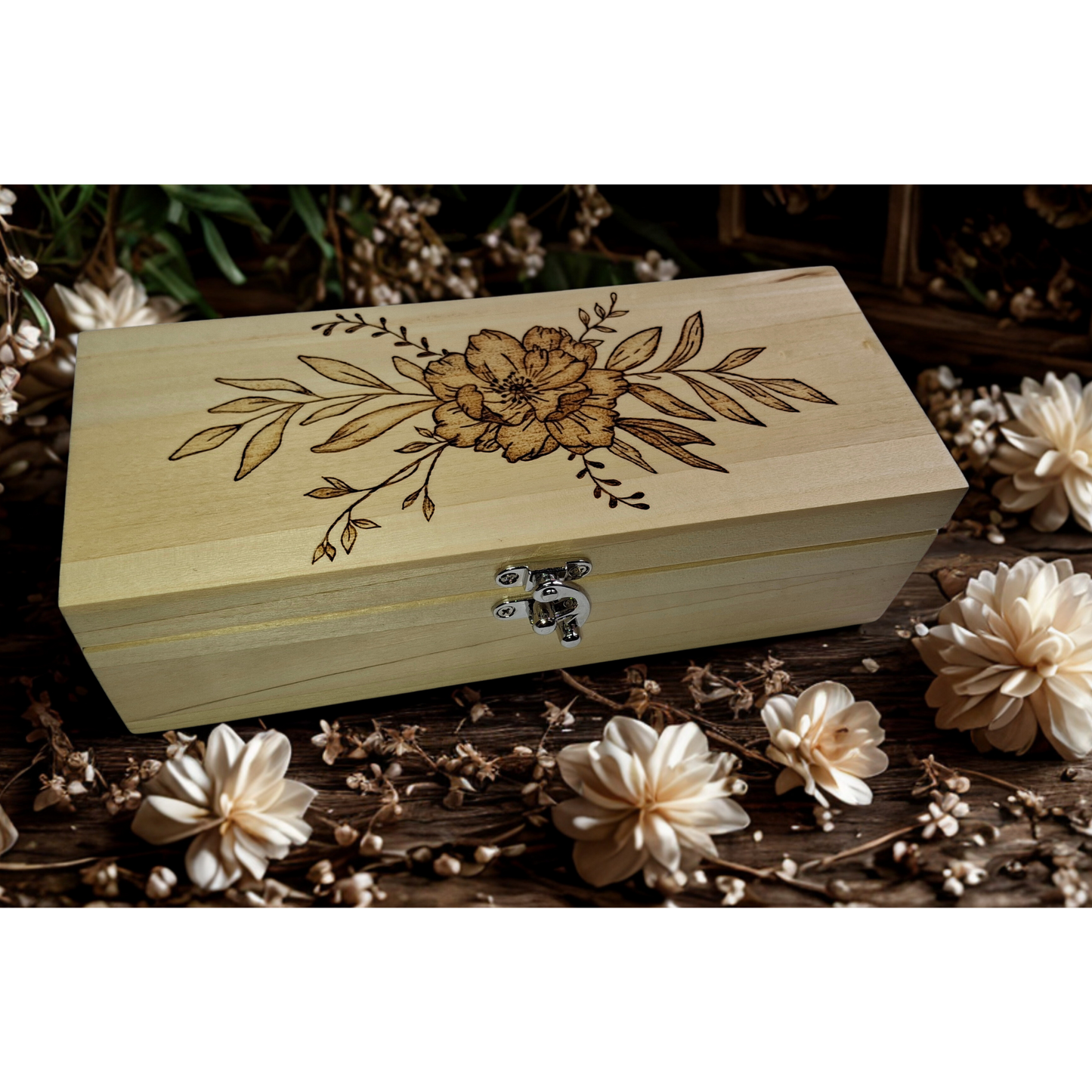 Light wood rectangular box featuring intricate pyrography floral patterns on its surface