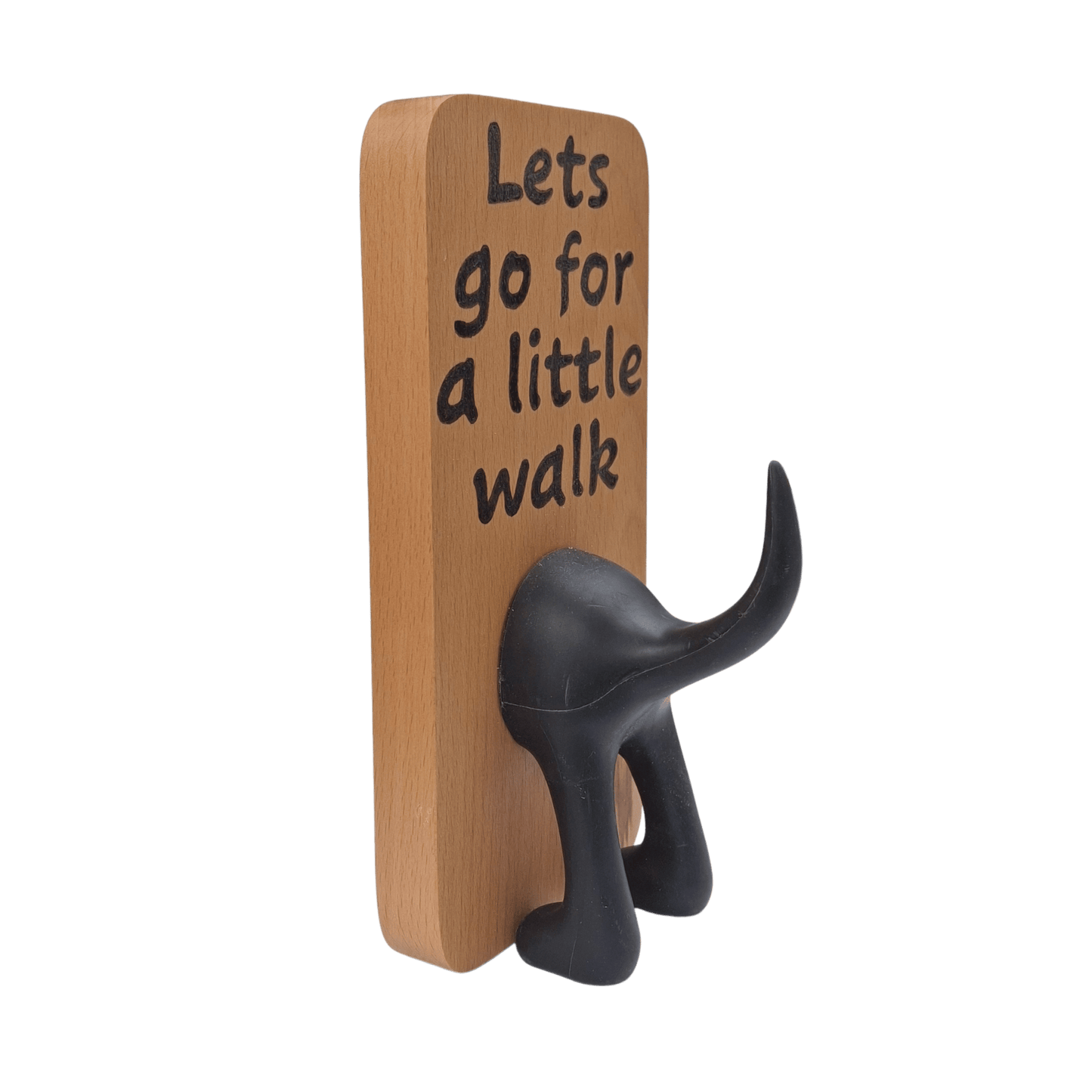 Wooden wall hook featuring the phrase "Lets go for a little walk" created with pyrography (hand burnt lettering). A black dog's rear end forms the hook.