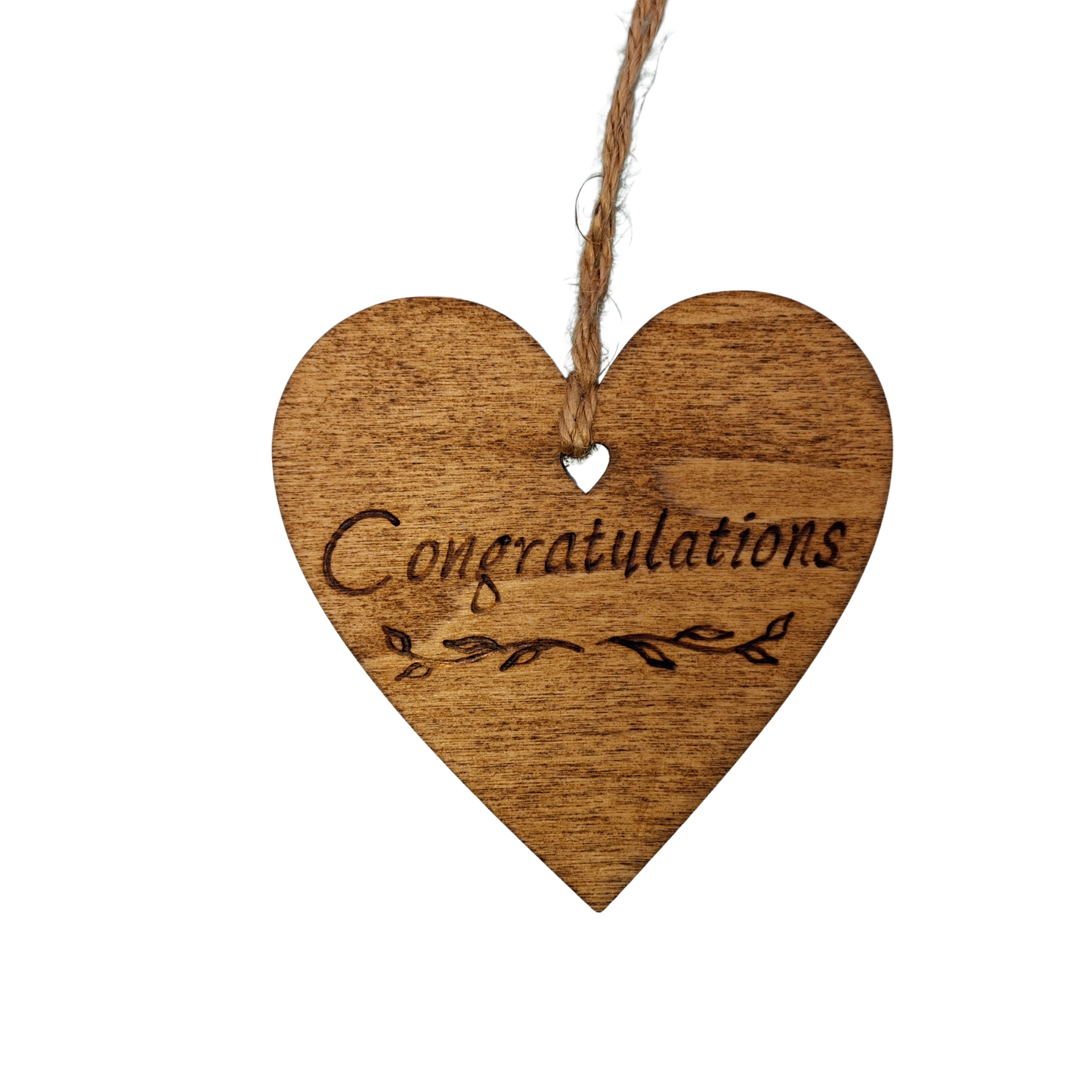 
Heart-shaped wooden ornament, hand-drawn with pyrography, featuring the engraved word "Congratulations" with decorative flourishes.