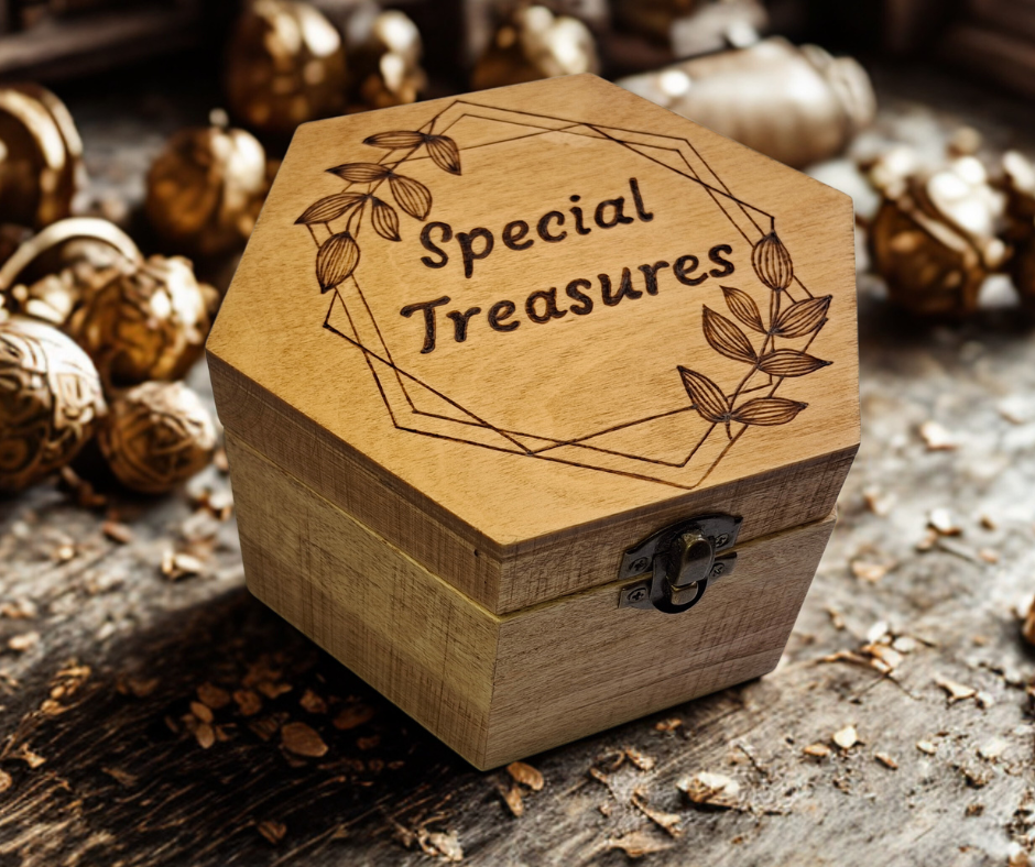 Box with "Special Treasures" inside a frame with leaves and straight lines burnt on top of the box
