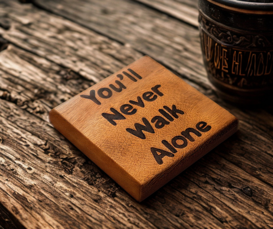 Sapele coaster with chamfered edges inscription "You'll Never Walk Alone" burnt in