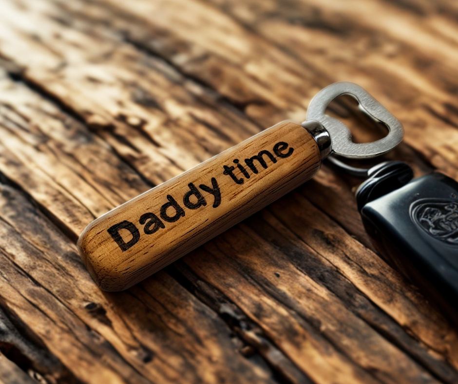 Ergonomic handheld bottle opener with a polished chrome head, intricately decorated with "Daddy Time" using pyrography