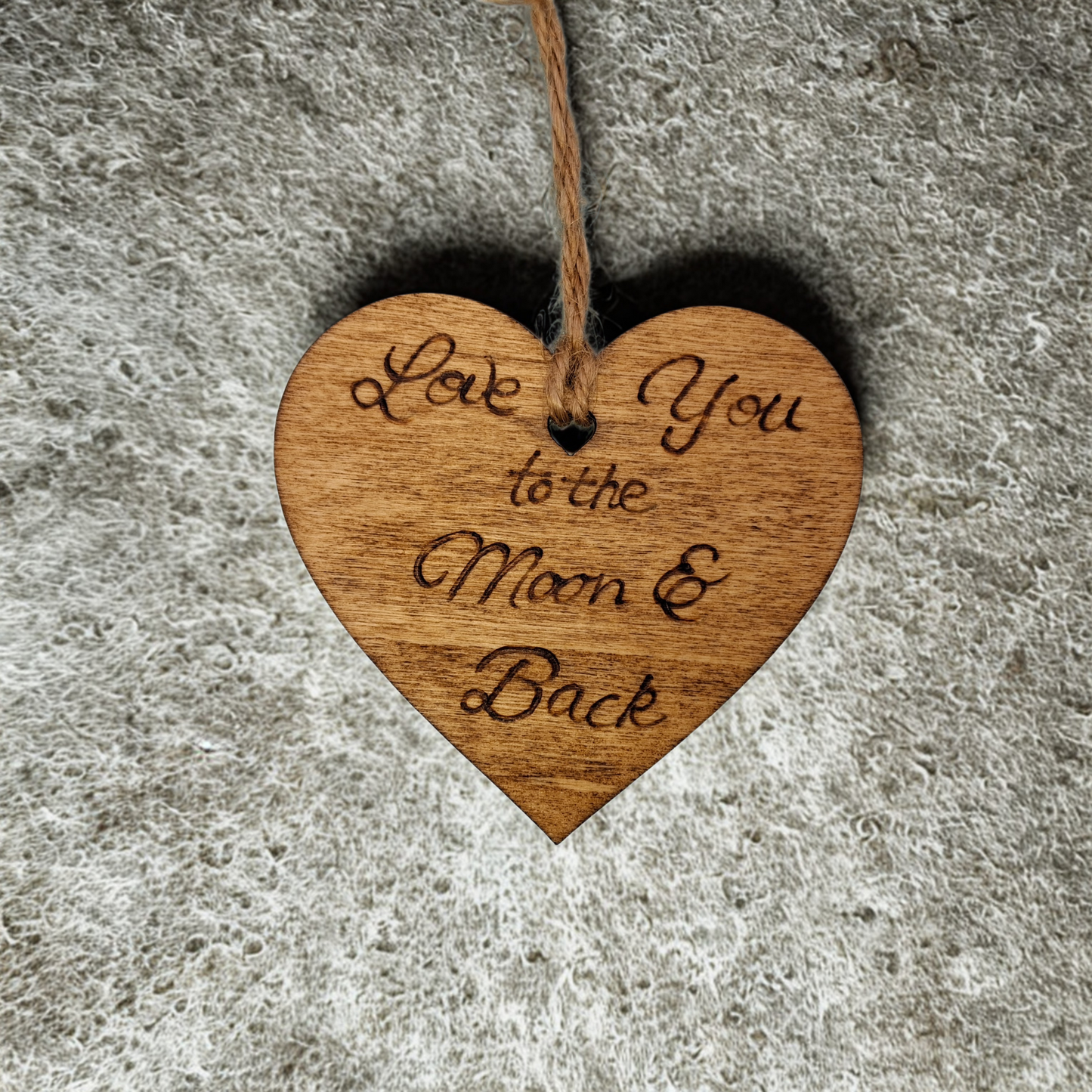 Wooden heart-shaped ornament with 'Our New Home' engraved text and natural jute string for hanging