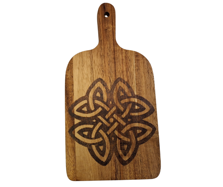 A multicolored, hand-decorated pyrography chopping board with a large Celtic knot design.