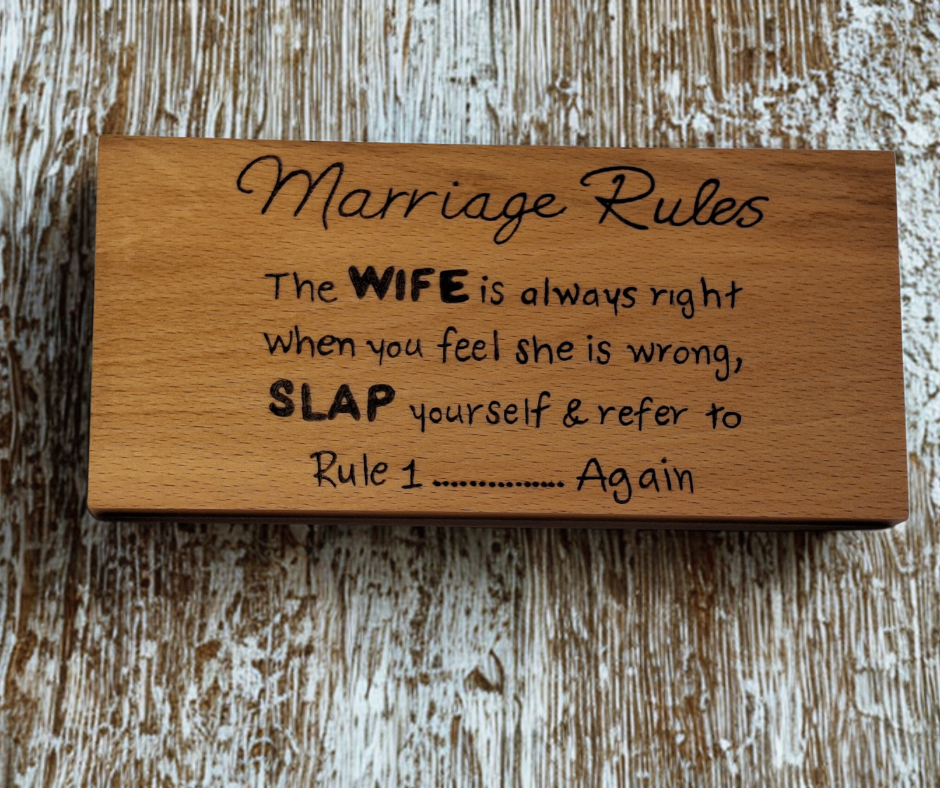 Wooden plaque hand-decorated with "Marriage Rules: The wife is always right, and if you think she's wrong, slap yourself and refer to rule 1."