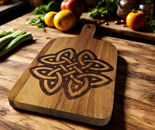 A multicolored, hand-decorated pyrography chopping board with a large Celtic knot design.