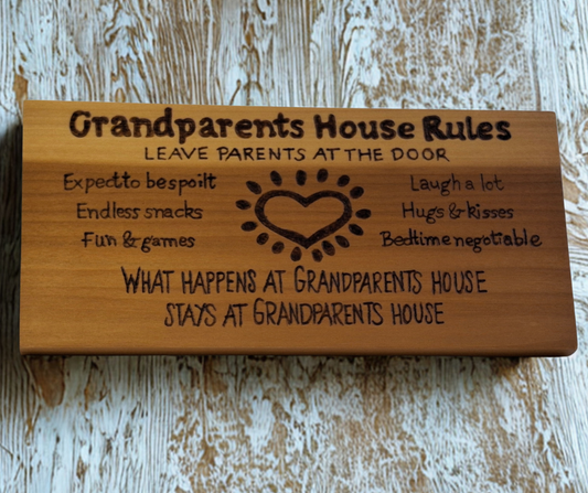Decorative wooden plaque for grandparents, intricately hand-decorated with "Grandparents House Rules" and a heart-shaped design outlining adorable family guidelines