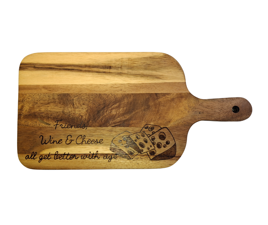 A multicolored, hand-decorated pyrography chopping board with the words "Friends, Wine & Cheese all get better with age" and illustrations of cheese chunks.