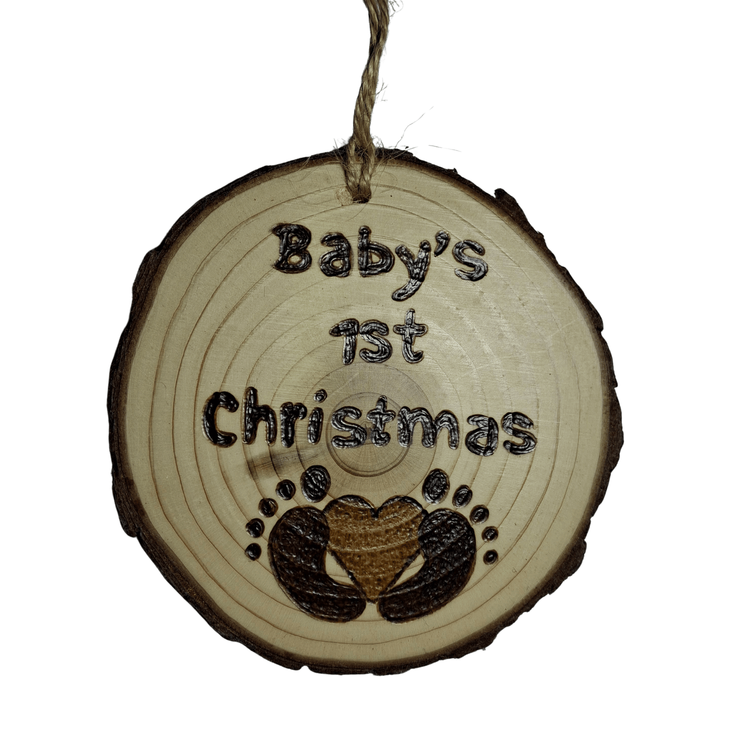 Wooden ornament with 'Baby's 1st Christmas' text and footprints on a clear background