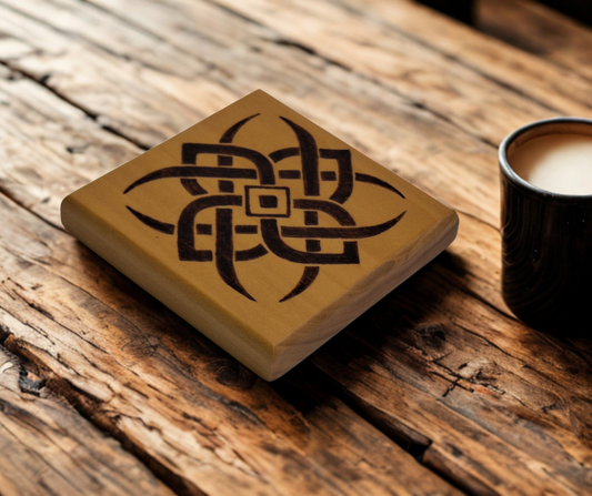 Tulipwood coaster with chamfered edges with a 4 point celtic star design burnt in