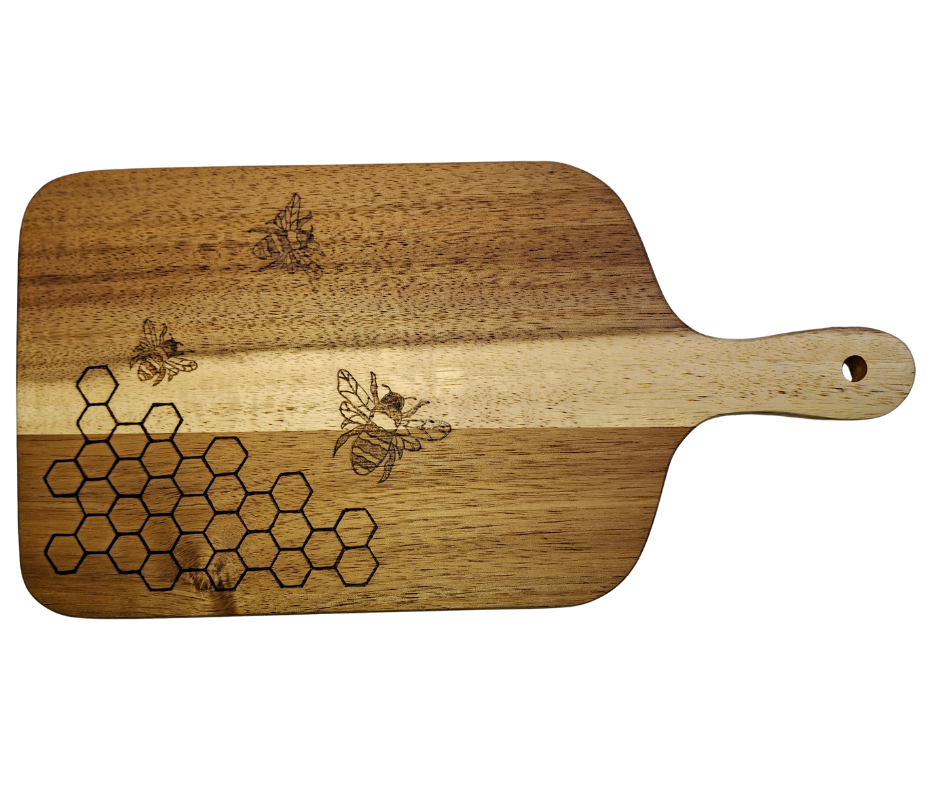 A multicolored, hand-decorated pyrography chopping board with a design of bees and hexagons, signifying a beehive.