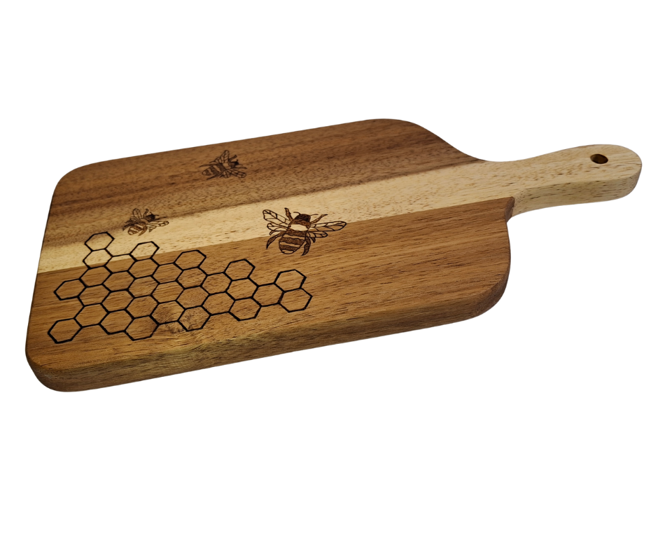 A multicolored, hand-decorated pyrography chopping board with a design of bees and hexagons, signifying a beehive.
