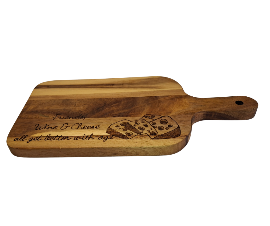 A multicolored, hand-decorated pyrography chopping board with the words "Friends, Wine & Cheese all get better with age" and illustrations of cheese chunks.