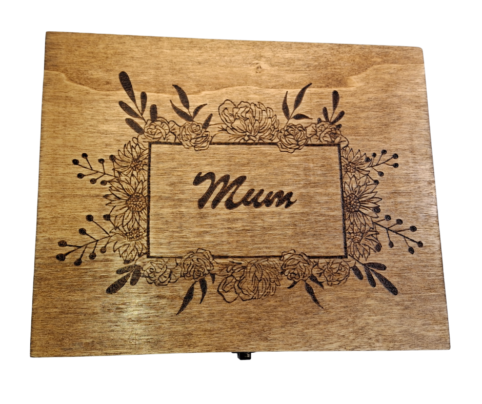 Wooden box with "Mum" hand-burnt inside a square frame, surrounded by Poinsettia flowers