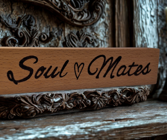 Freestanding wooden desk sign, hand-decorated with "Soul Mates" pyrography, with a small heart separating the words.
