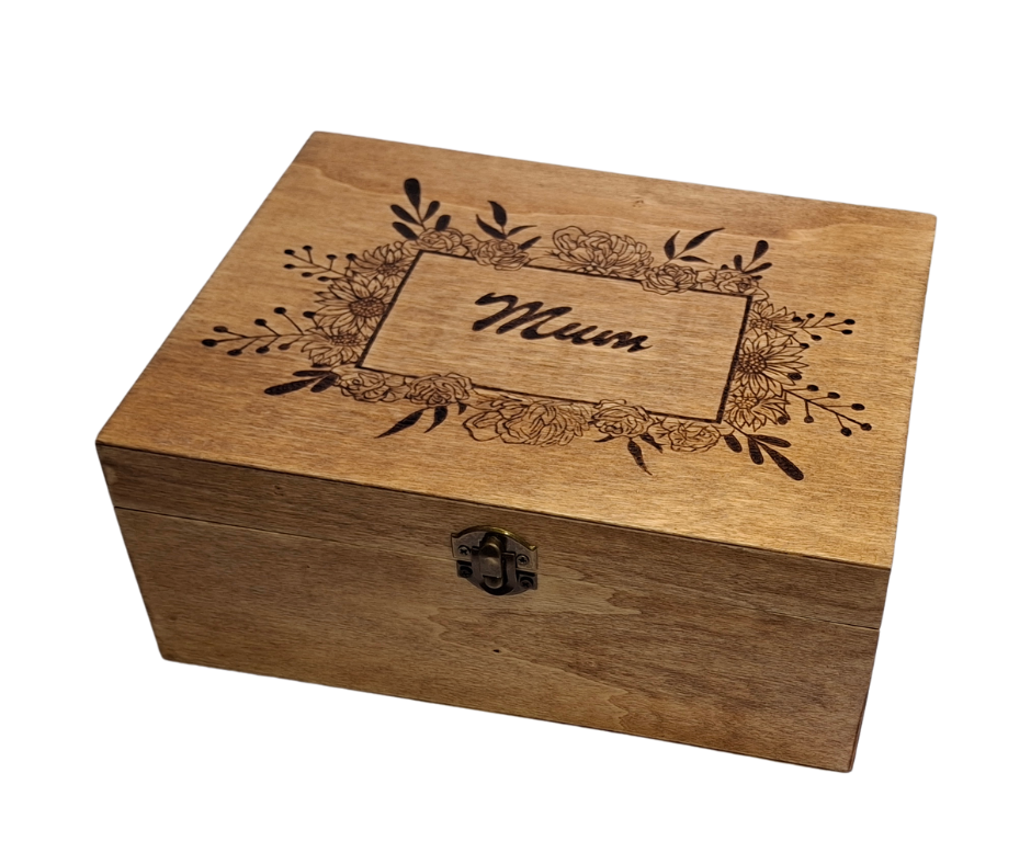 Wooden box with "Mum" hand-burnt inside a square frame, surrounded by Poinsettia flowers
