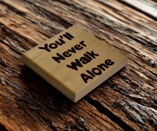 Tulipwood coaster with chamfered edges inscription "You'll never walk alone"  burnt onto the wood