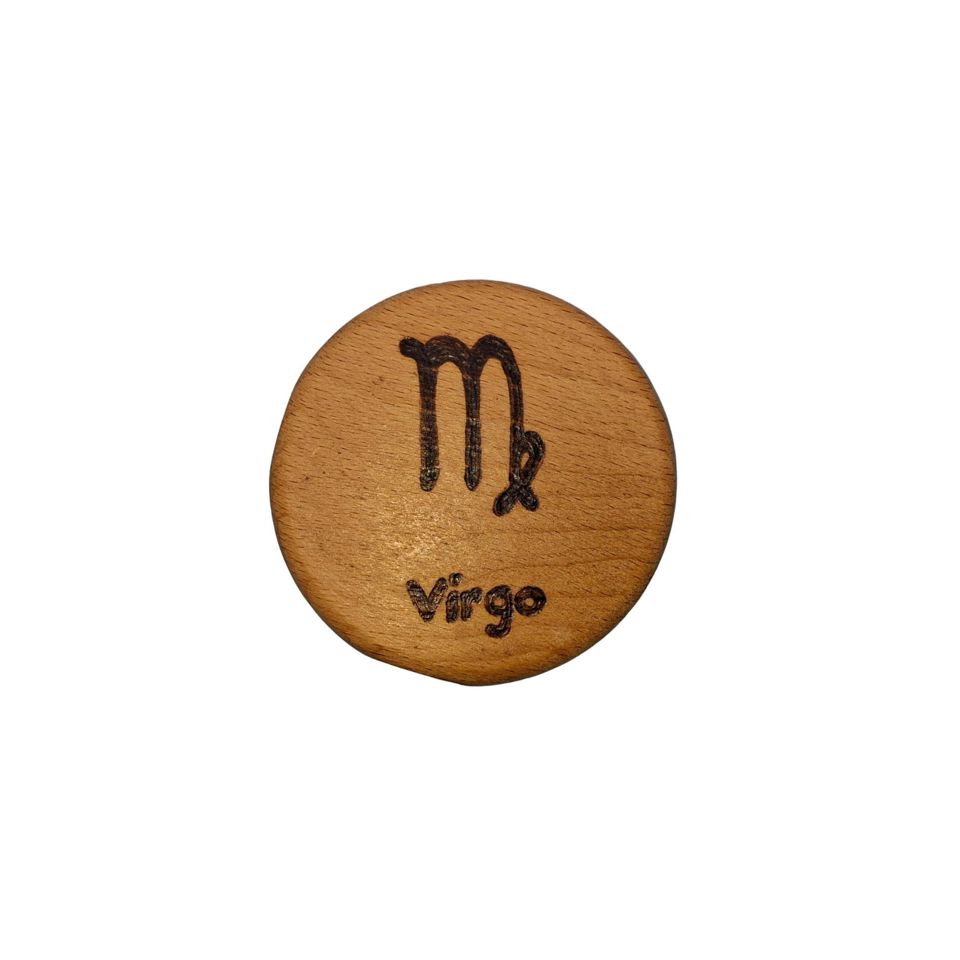 Close-up of a light-colored beechwood circle, 5cm in diameter and 0.4cm thick, featuring the words "Virgo" and an illustration of the star sign symbol,  hand-burned into its surface using pyrography. The wood has a smooth, waxed finish and the text is clearly legible.
