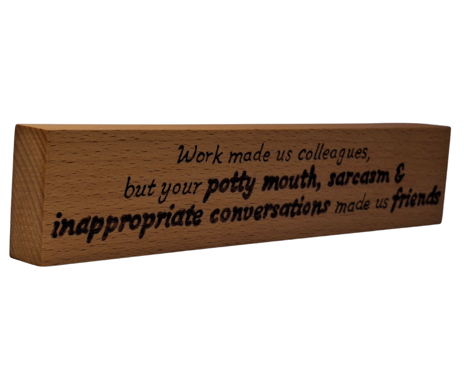 Decorative wooden desktop sign, intricately hand-decorated with a humorous quote about colleagues becoming friends through shared "potty mouth and sarcasm."