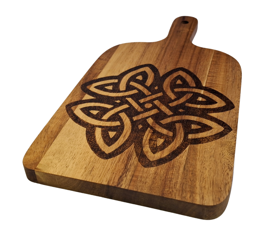 A multicolored, hand-decorated pyrography chopping board with a large Celtic knot design.