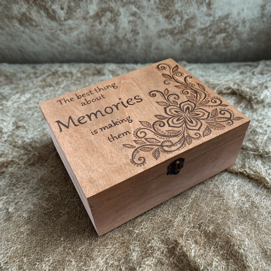 Wooden box with hand burnt floral design and "The Best thing about Memories is making them"