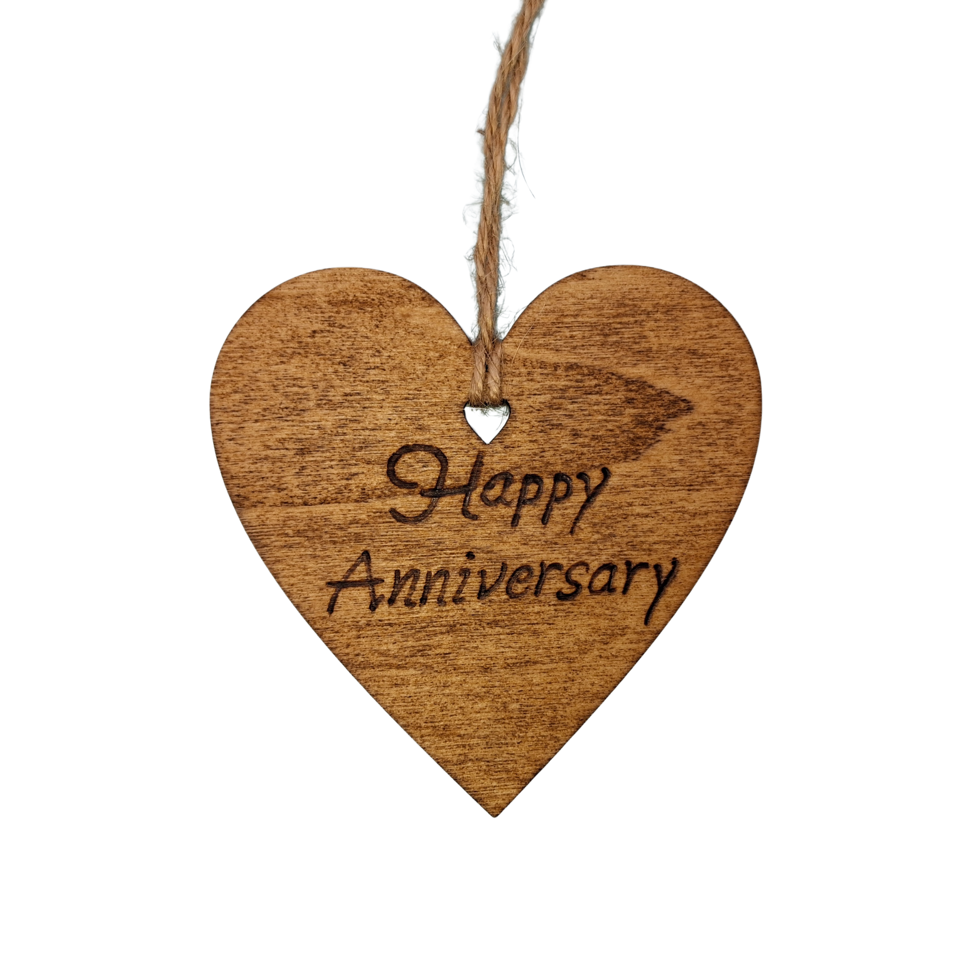 
Heart-shaped wooden ornament, hand-drawn with pyrography, featuring the engraved phrase "Happy Anniversary" in a decorative script, set against a light, plain background.