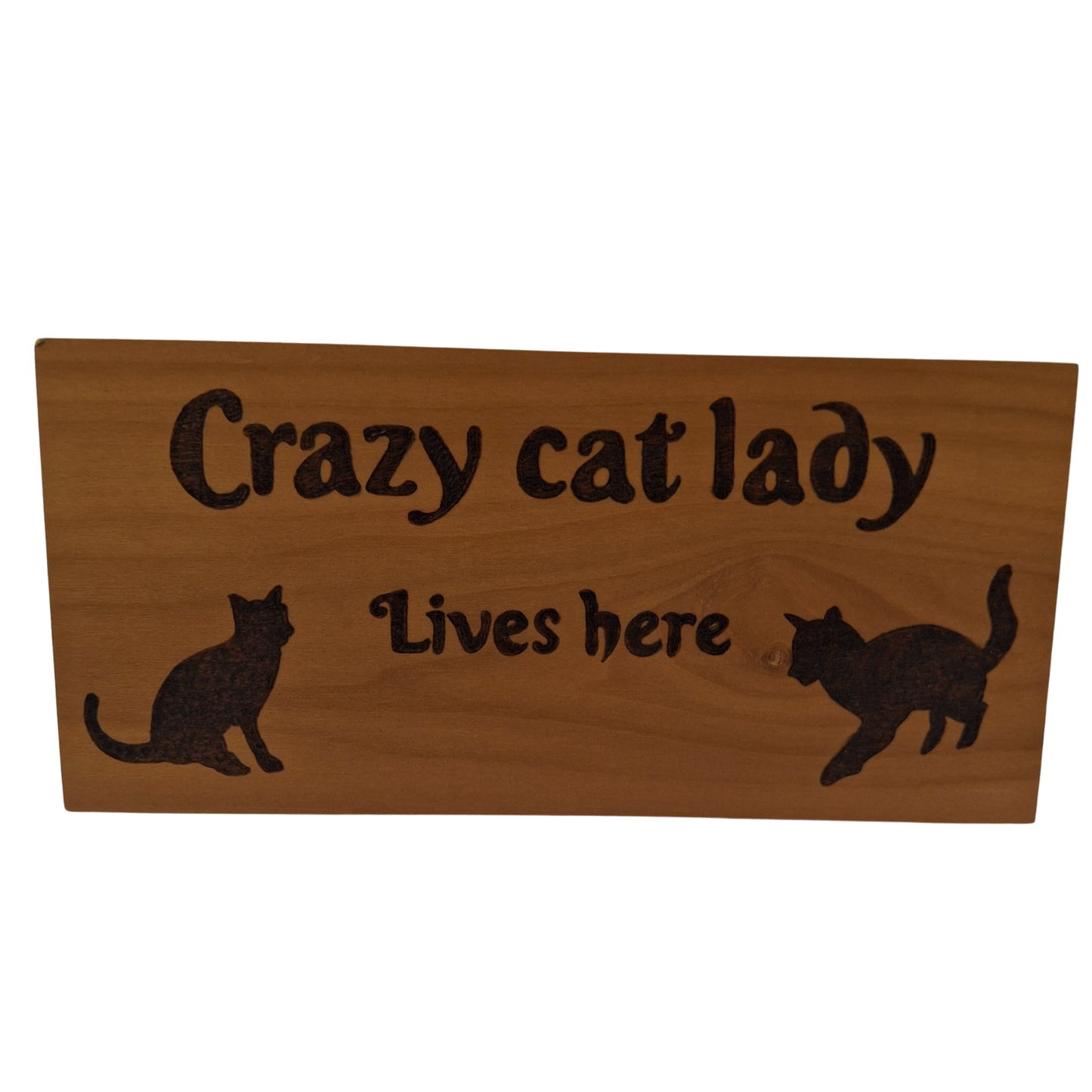 Wooden sign with 'Crazy cat lady lives here' text and cat illustrations on a white background